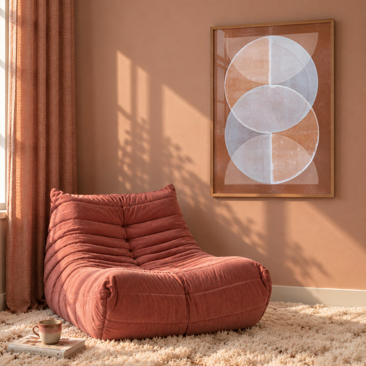 Terracotta and beige Energy Giver abstract art print by Marijn Vink in a modern colourful dopamine interior with a Togo sofa